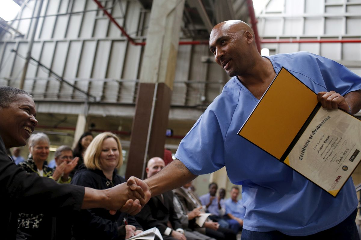 Program graduate receiving certificate